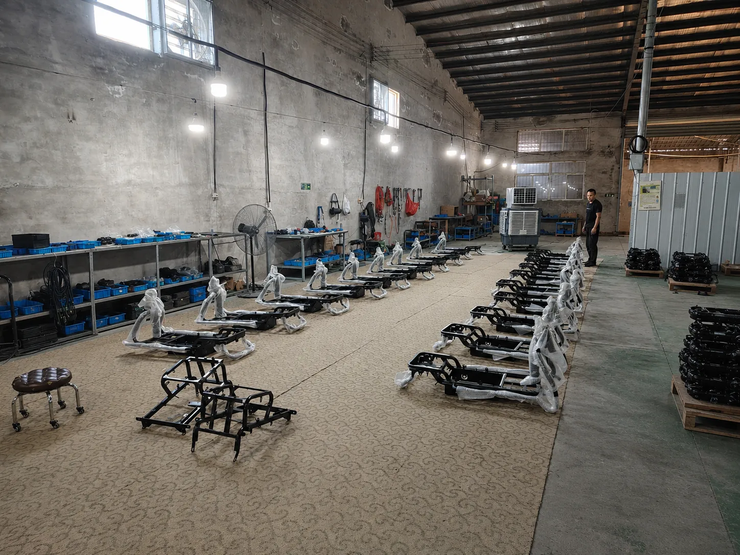 Electric tricycle components prepared for assembly at NAVERO